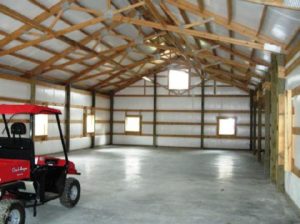 White Construction - post-frame building interior with atv
